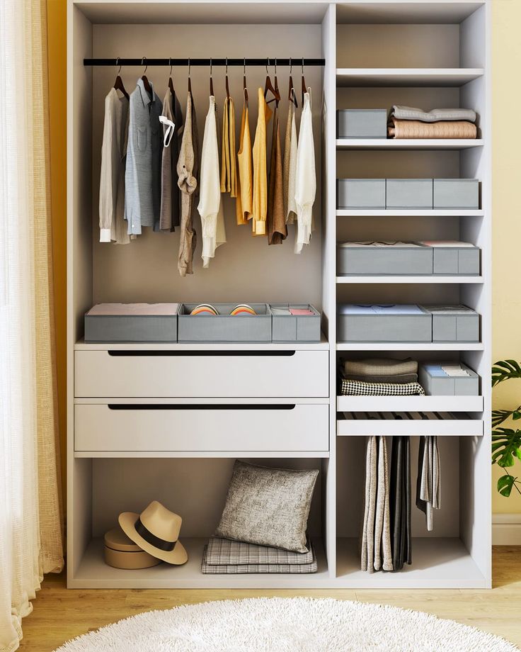 an organized closet with clothes and shoes