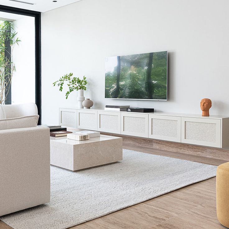 the living room is clean and ready to be used as a home entertainment center or office