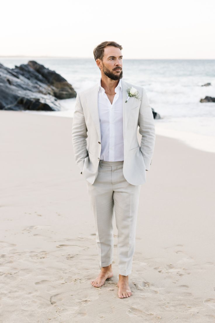 Seaside, coastal feel, relaxed summer vibes Grey Suit Beach Wedding, Summer Beach Wedding Groom Attire, Coastal Wedding Outfit Men, Beach Wedding Husband Outfit, Beach Wedding Wear For Men, Light Grey Suit Beach Wedding, Simple Beach Wedding Ideas Groom Attire, Coastal Groomsmen Attire, Coastal Groom Attire