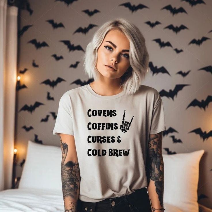 Covens Coffins Coffee Cold Brew Shirt Skeleton Hands, Vintage Halloween, Retro Fall Shirt, Witch Shirt, Retro Halloween Shirt, Creepy Gift ️ Embrace the witchy vibes with our "Covens Coffins Coffee Cold Brew" shirt! Perfect for those who love all things mystical and caffeinated, this shirt features a stylish and whimsical design that combines covens, coffins, and cold brew coffee. Available in various sizes and colors, it's made from soft, comfortable fabric that's perfect for everyday wear. 🌙? Halloween Diy Shirts For Women, Circuit T Shirt Designs, Witchy Vibes Aesthetic, Creepy Gift, Halloween Moms, Funny T Shirt Sayings, Halloween Retro, Cute Shirt Designs, Brew Coffee