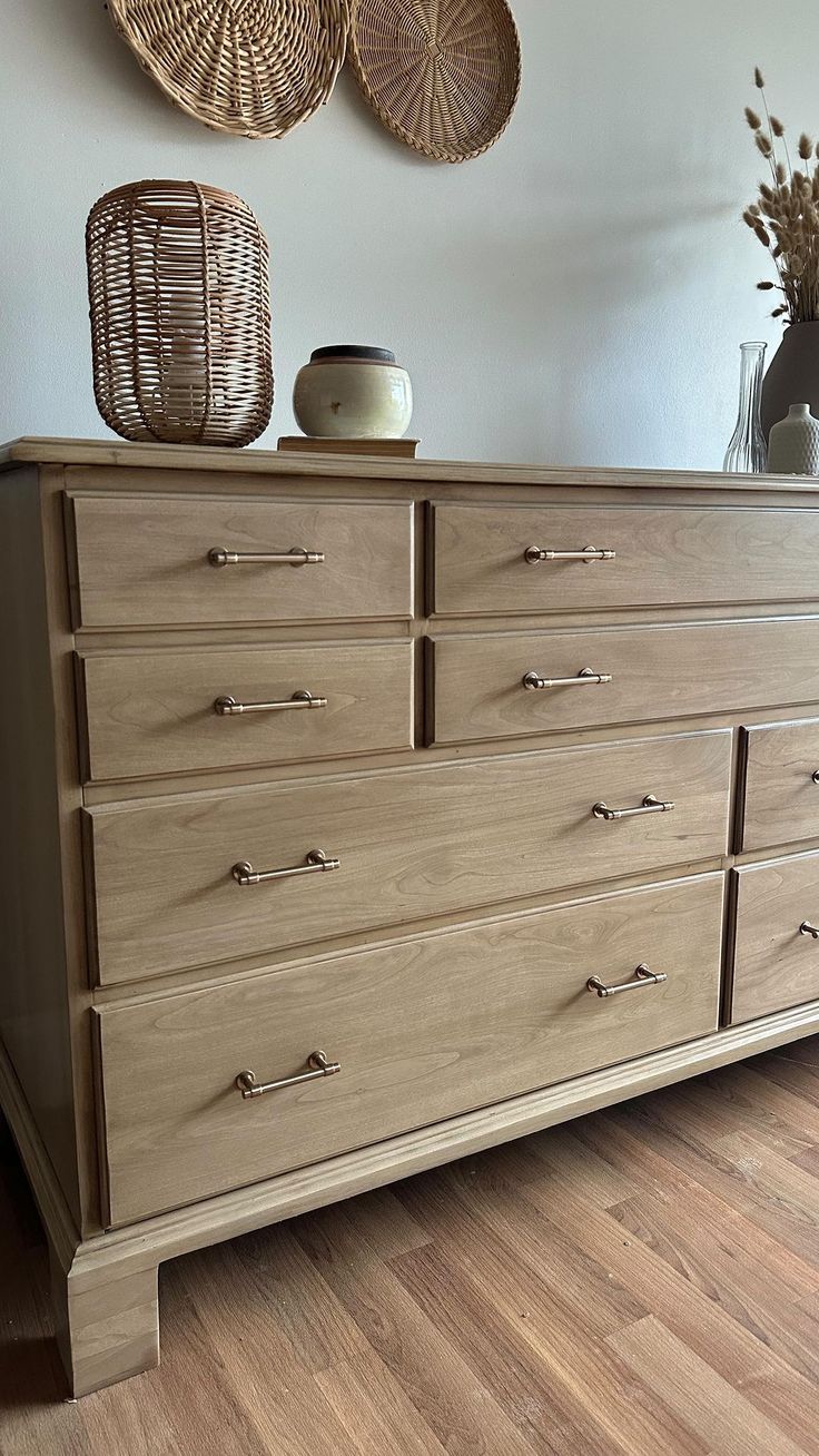 a large wooden dresser sitting on top of a hard wood floor