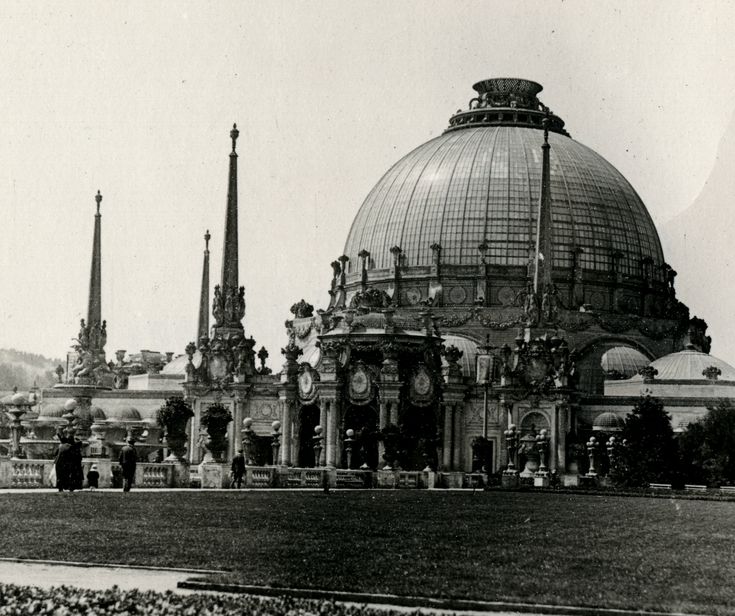 an old black and white photo of a building with many spires on it's roof