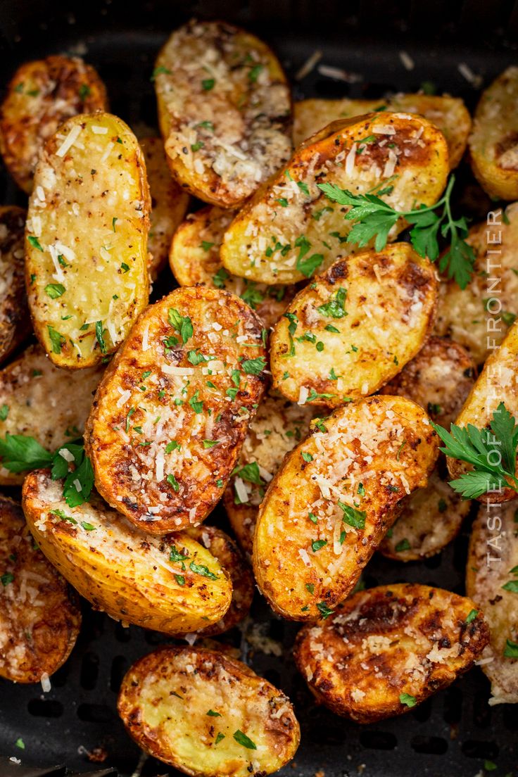 cooked potatoes with parmesan cheese and herbs