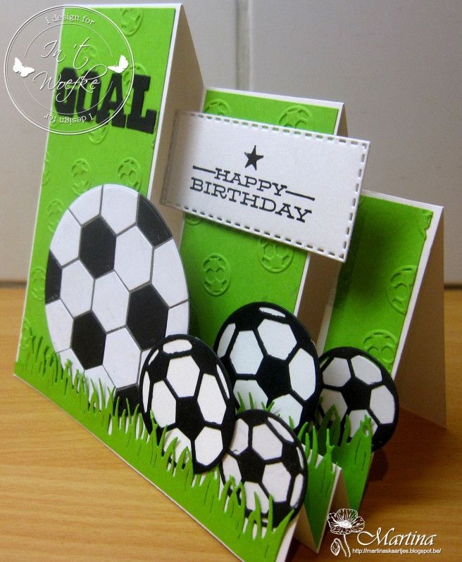 a birthday card with soccer balls in the grass