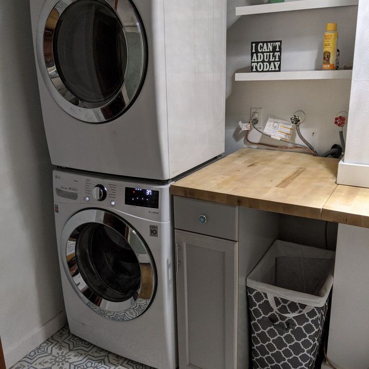 a washer and dryer in a small room