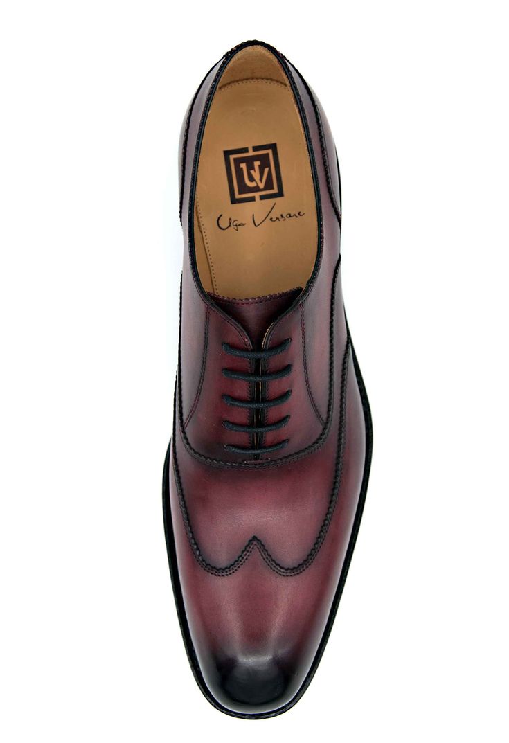 Style: 2022-1233-Burgundy Completely Handmade, this Stunning Burnished Calfskin lace-up Wingtip Oxford from the Ugo Vasare collection features Goodyear Welted construction, Pinking detail, a stitched welt and a full Leather sole! Don't see your size? This style may be special ordered. . Luxury Burgundy Wingtip Dress Shoes, Luxury Fitted Lace-up Dress Shoes, Luxury Fitted Lace-up Shoes With Brogue Detailing, Burgundy Lace-up Oxfords With Leather Sole, Burgundy Lace-up Dress Shoes With Leather Sole, Elegant Fitted Lace-up Shoes With Leather Lining, Designer Fitted Oxfords With Brogue Detailing, Elegant Fitted Oxfords With Laces, Classic Burgundy Lace-up Oxfords