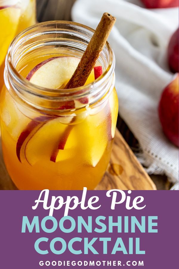 an apple pie drink in a mason jar with cinnamon stick and apples on the side