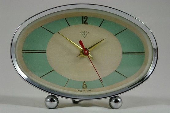 an alarm clock sitting on top of a table