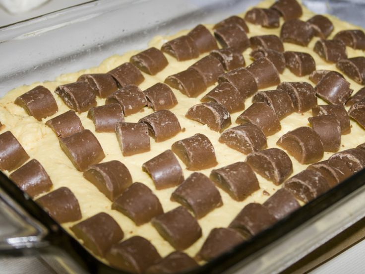 a pan filled with chocolate pieces on top of a counter