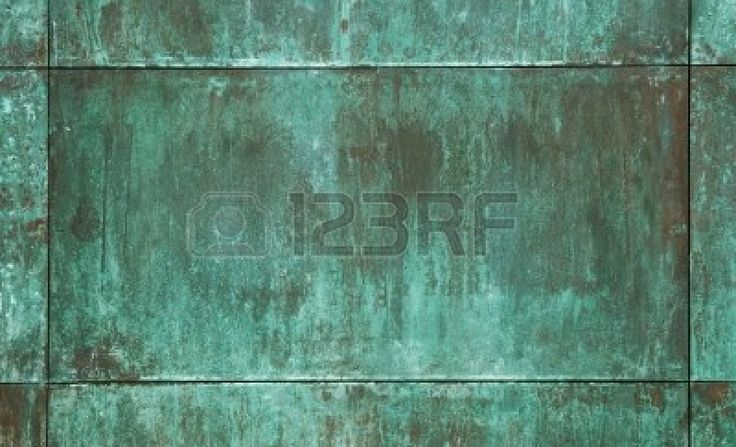 an old rusty green wall with peeling paint