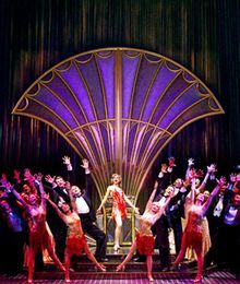 a group of people standing on top of a stage