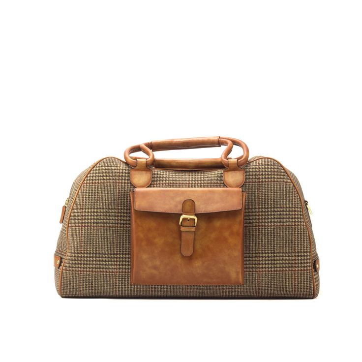 a brown and tan handbag on a white background with the handle extended to it's side