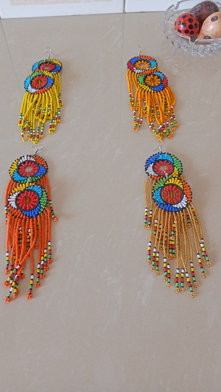 Wholesale African earrings, Beaded earrings, Boho earring, Elegant assorted earrings, Zulu earring, Gift for her, Tribal earring The listing is for ALL 12 pieces . These Zulu beaded earrings are superbly crafted which can be worn with any outfit at different occasions and they will absolutely make you stand out. These colorful earrings are very light to wear. Selecting one quantity means that you receive the 14 pairs. If you want to rule out some colors and replace them with others of your choic Traditional Beaded Earrings With Round Beads, Traditional Multicolor Beaded Earrings, Traditional Colorful Beaded Earrings For Festive Occasions, Traditional Multicolor Earrings With Colorful Beads, Traditional Festive Beaded Earrings With Colorful Beads, Unique Round Beads Earrings For Festivals, Festive Colorful Beaded Earrings, Festive Yellow Beaded Earrings, Traditional Beaded Earrings For Festivals With Ear Wire