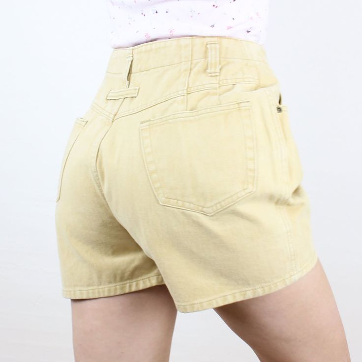 Item Description  These are so fun and unique! I love this brand, and the high rise and baggy-fit style is so fun and so classic early 90s! These are in a soft yellow color and are made of a 100% cotton rigid denim! They have belt loops that are set a bit lower than the waistband, front and back pockets, and a unique pleat design, where some of the pleats are actually in the pockets! These are meant to have a fun curvy/baggy fit (not at all slim) so definitely take a look at the measurements to Y2k Bottoms With Built-in Shorts For Spring, Y2k Bottoms With Built-in Shorts For Summer, Y2k Wide Leg Summer Bottoms, Y2k Cutoff Jean Shorts For Spring, Y2k Jean Shorts For Summer, Summer Cotton Jean Shorts, Y2k Style Jean Shorts For Summer, Summer Y2k Jean Shorts, Y2k High Waist Cotton Bottoms