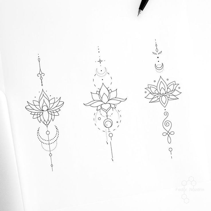 three different designs on a piece of paper next to a pen and ink drawing pencil