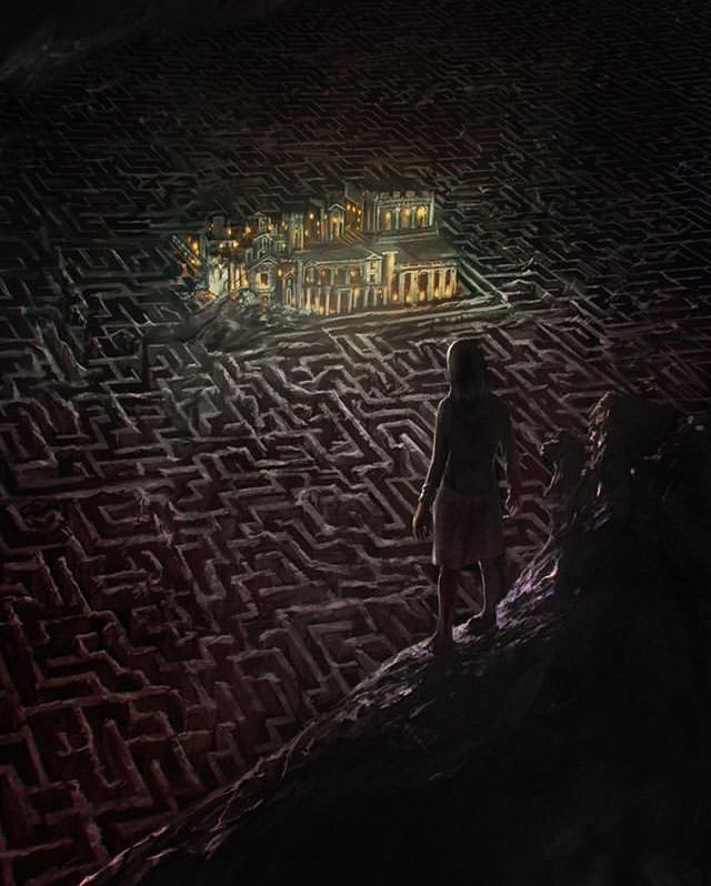 two people are standing in the middle of a maze with a city on it at night