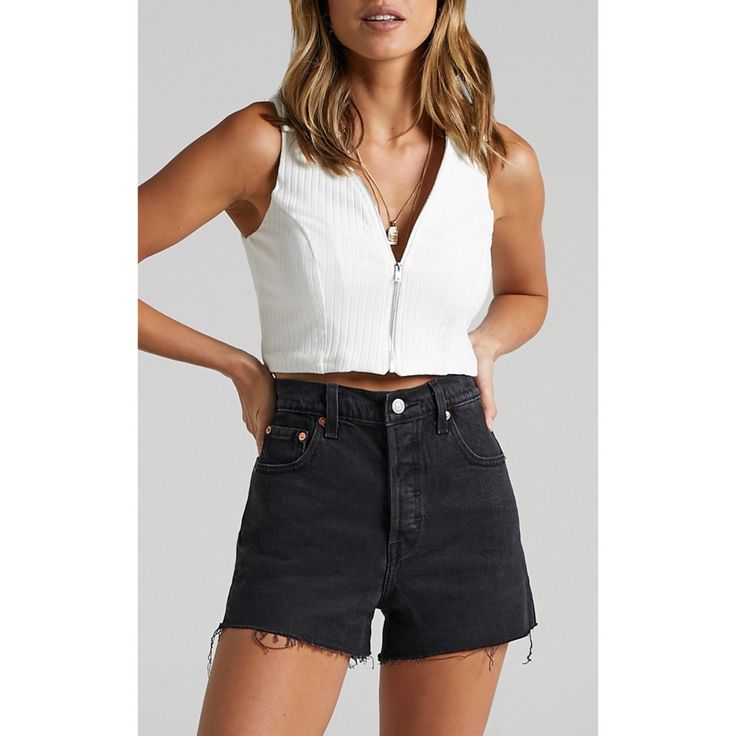 Levi's Highest High Rise Yet. The Ribcagewith Its Soaring 12-Inch Risehas Become A Hip-Slimming And Waist-Defining Obsession. This Fit Will Show Off Your Figure And Make You Feel As Amazing As You Look. Cut-Off Hem Style # 778790052 Color: Blackl Lake - Black Slim Through Your Hip Super High Rise 99% Cotton, 1% Elastane Low Stretch Denim Button Fly 5-Pocket Styling Fitted Cutoff Shorts For Night Out, Levi's Edgy Spring Bottoms, Edgy Mid-rise Levi's Bottoms, Levi's Short Length Summer Tops, Edgy Levi's Bottoms For Spring, Levi's Summer Tops, Summer Levi's Tops Short Length, Black Cutoff Tops For Summer, Chic Mid-rise Shorts For Night Out