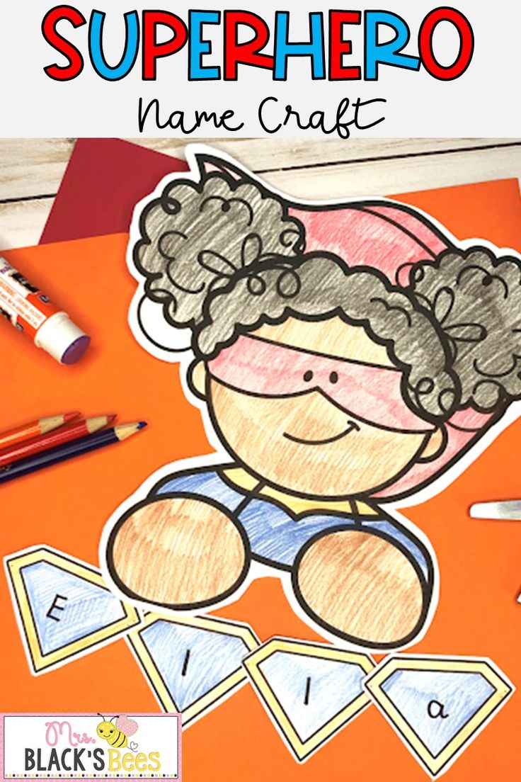 a super hero name craft with markers and pencils on an orange background, next to some crayons