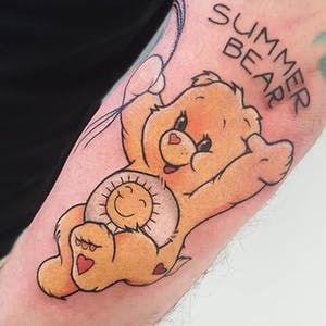 a man with a tattoo on his arm has a bear holding a teddy bear that says summer bears