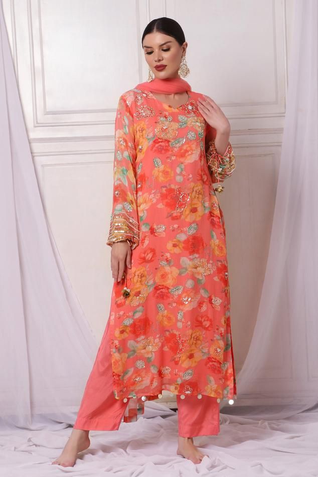 Pink georgette kurta with floral print and sequins, pearls, cutdana and stones embroidery. Comes with shantoon pant and a net dupatta.
Components: 3
Pattern: Printed, Embroidered
Type Of Work: Floral, Sequins, Pearls, Cutdana
Neckline: Leaf Neck
Sleeve Type: Full
Fabric: Kurta : Georgette, Pant : Shantoon, Dupatta : Net, Lining : Shantoon
Color: Pink
Other Details: 
Attached lining
Length :
Kurta : 50 inches
Pant : 38 inches
Product Weight : 1 Kg
Closure : Kurta - Back hook
Occasion: Sangeet - A Georgette Kurta, Pink Kurta, Net Dupatta, Kurta With Pants, Pant Set, Set For Women, Aza Fashion, Sleeve Type, Pink Floral