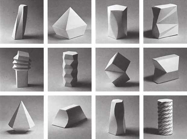 several different shapes are shown in black and white, including an origami sculpture