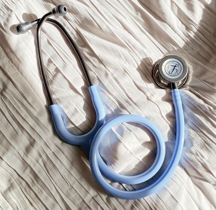 a stethoscope laying on top of a bed