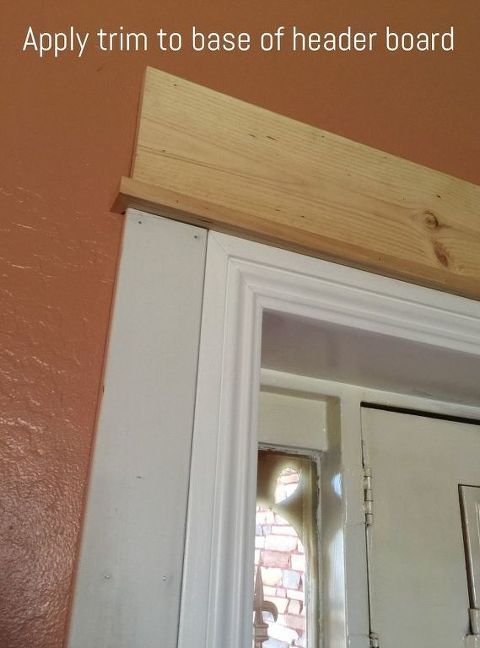 an open door with the words apply trim to base of header board above it