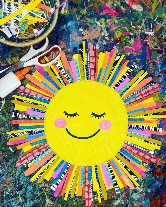 a sun made out of colored crayons and scissors