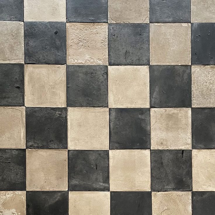 a black and white checkered tile wall