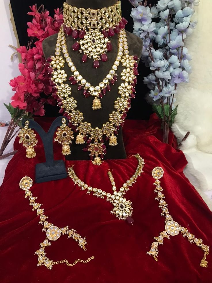 an assortment of necklaces and earrings on display