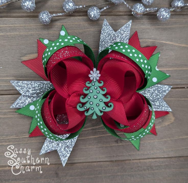 This beautiful Christmas bow features silver glitter, red, and  polka dot ribbon. Its finished with a whimsical Christmas tree centerpiece.  Measures approximately 4 1/2" x 5". This bow is stiffened to help maintain its shape. This bow is secured to a 1.75" covered alligator clip and comes with the standard slip grip to help keep it in place. **This bow may contain small pieces and may be a choking hazard to children under the age of 3. Please be sure to read the disclaimer under terms and condi Country Girl Hair, Tree Centerpiece, Small Hair Bows, Holiday Hair Bows, Whimsical Christmas Trees, Bows Christmas, Tree Centerpieces, Holiday Hair, Christmas Hair Bows