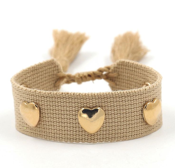 Crafted with an adjustable woven wristband, this bracelet features golden heart-shaped metal rivets and a decorative tassel that is sure to make your girls trip, girls weekend or girls getaway unforgettable. Thoughtful and trendy, this bracelet makes the perfect gift for your bridal party. A sweet gift for your rehearsal dinner, wedding weekend or bachelorette trip gift! Please make any requests known to me in the box provided at the check out window! This listing is for:1 woven thread bracelet Trendy Woven Jewelry For Gift, Trendy Woven Jewelry As A Gift, Casual Gold Woven Jewelry, Trendy Woven Jewelry For Festivals, Gold Woven Braided Bracelets For Friendship, Casual Woven Bracelets, Casual Woven Bracelet, Gold Woven Bracelets For Friendship, Trendy Bracelets With Adjustable Length For Festivals