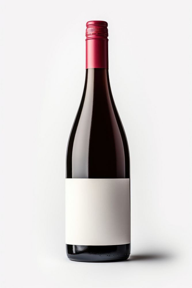 a bottle of red wine with a white label on the top and bottom, in front of a plain background