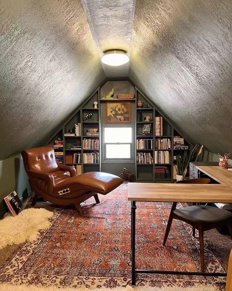 a room with a desk, chair and bookshelf in the middle of it