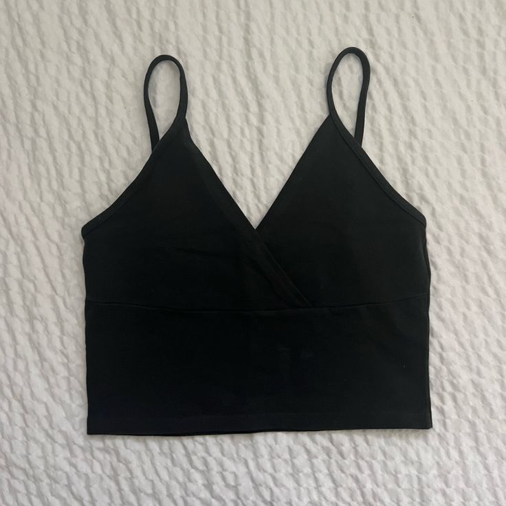 Nwot Never Worn Perfect And Super Cute Summer Crop V-Neckline, A Surplice Front, And A Cropped Fit 96% Cotton, 4% Elastane Black V-neck Crop Top With Built-in Bra, Black Stretch V-neck Crop Top, Seamless V-neck Tank Top For Night Out, Black V-neck Crop Top For Spring, Black Seamless V-neck Top, Black V-neck Crop Top For Summer, Solid V-neck Top With Built-in Bra, Chic Black V-neck Crop Top, V-neck Crop Top With Built-in Bra