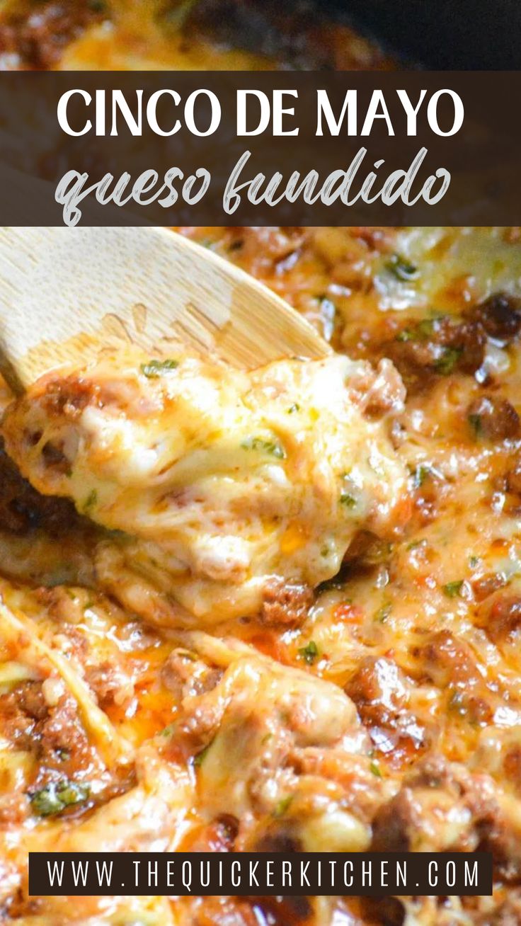 a close up of a wooden spoon in a casserole dish with meat and cheese