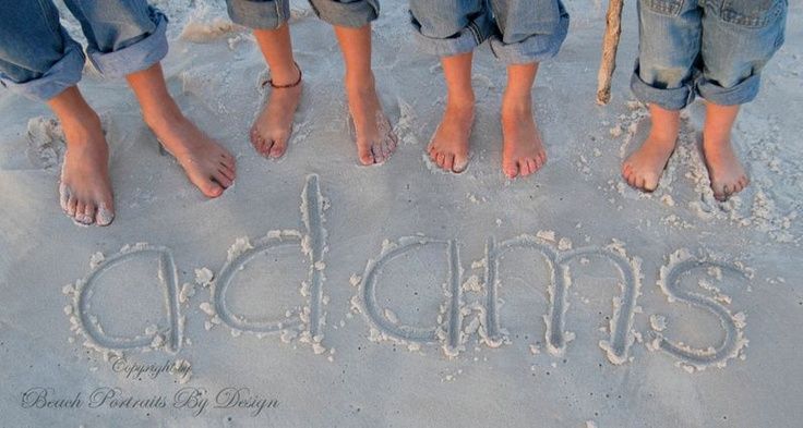 three people standing in the sand with their feet up and writing on them that says cadanis