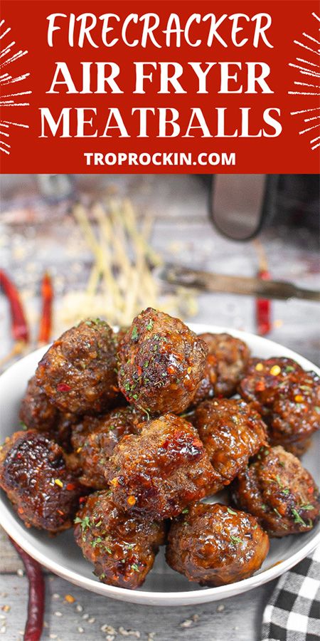 a white plate topped with meatballs covered in sauce