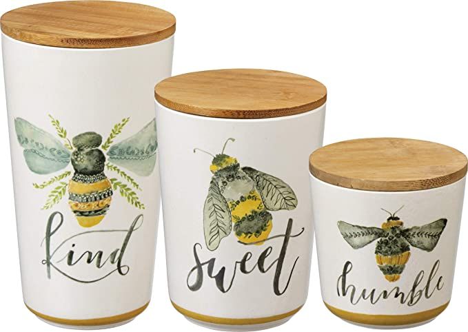 three ceramic jars with bees and words on them