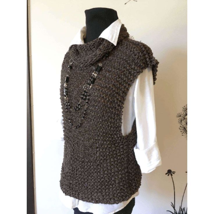 a mannequin wearing a brown knitted vest