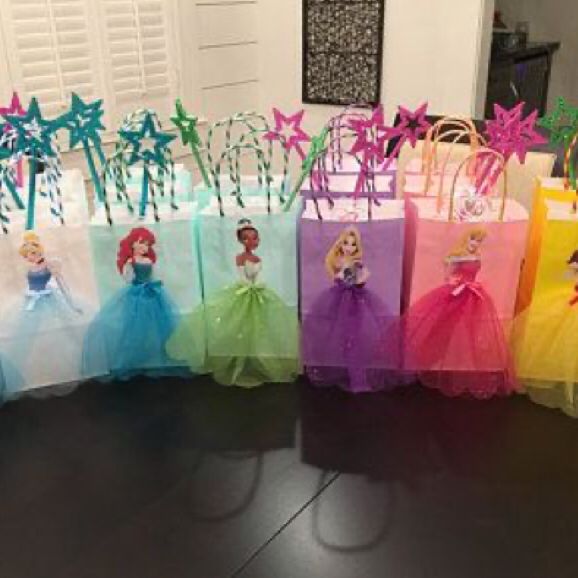 there are many bags with princesses in them on the table, all lined up