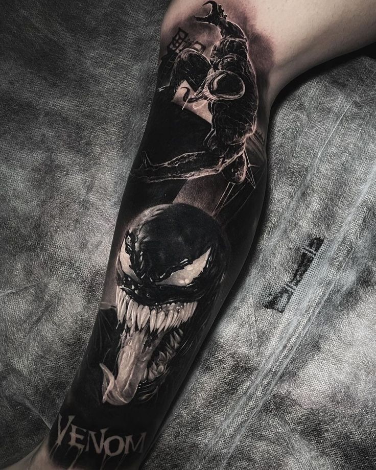 a man with a black and white tattoo on his arm that has an image of a demon