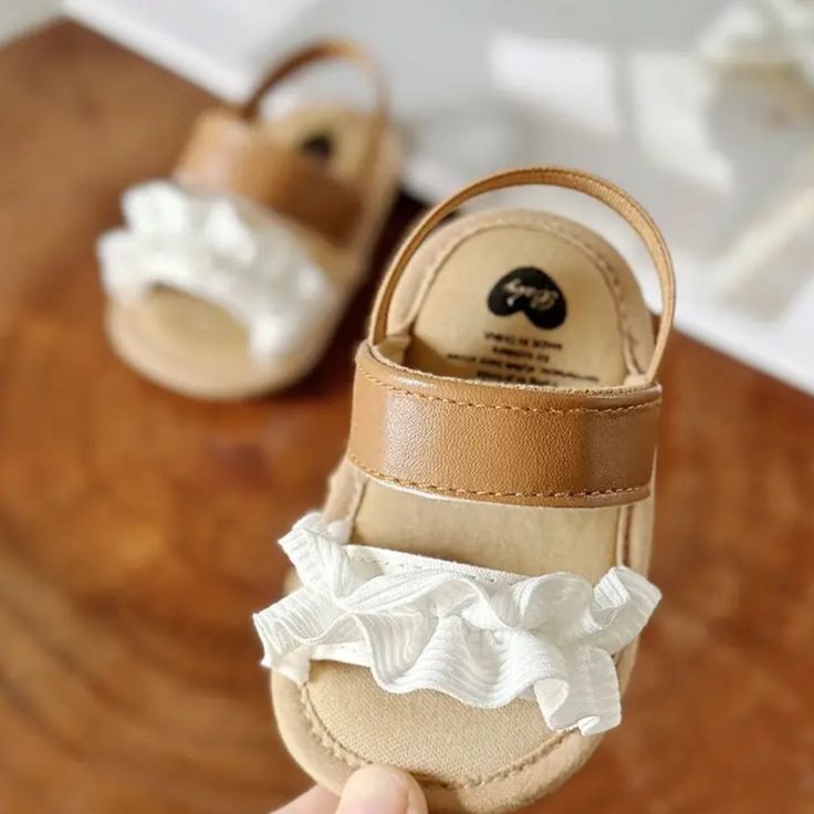 These Sandals Are Perfect For Any Baby Outing White Adjustable Non-slip Sandals, White Sandals For Summer Playtime, White Non-slip Sandals For Vacation, Adjustable White Sandals For Playtime, White Non-slip Sandals For Beach, Non-slip White Beach Sandals, White Non-slip Beach Sandals, Summer Ruffle Open Toe Sandals, Summer Ruffled Open Toe Sandals