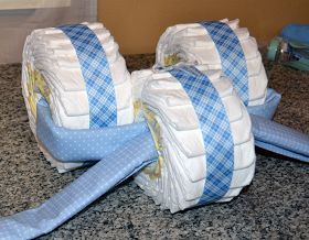 two rolls of diapers sitting on top of a granite counter next to a wall