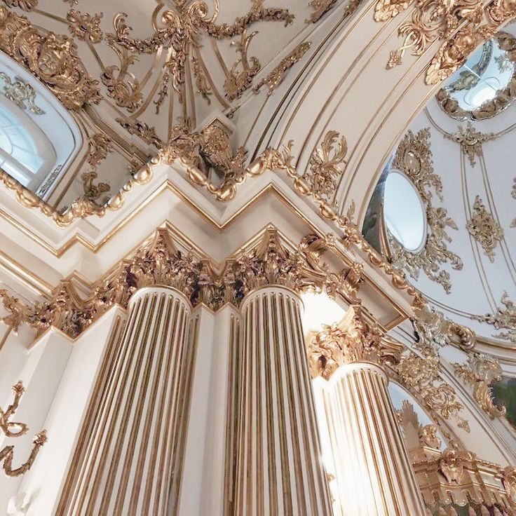 an ornately decorated ceiling in a church with chandeliers and windows on each side