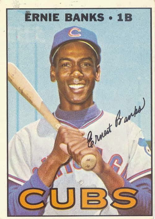 a close up of a baseball card with a person holding a bat and smiling at the camera