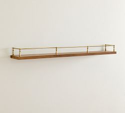 a wooden shelf mounted to the side of a wall