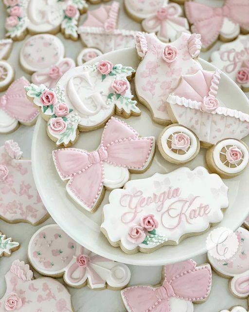 baby shower cookies with pink and white decorations