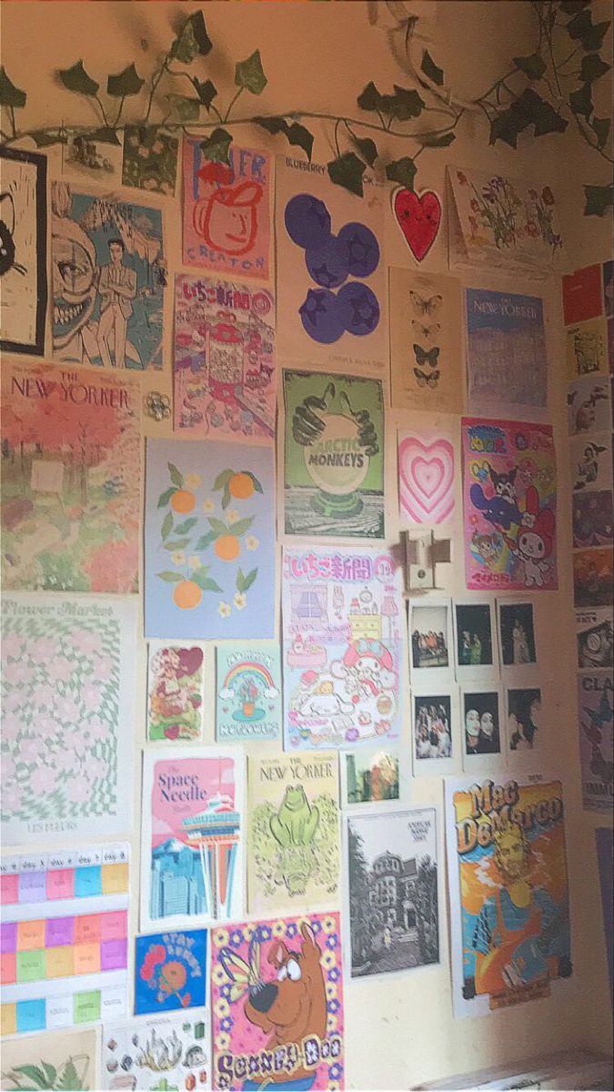 a wall covered in lots of different types of posters and stickers on it's side