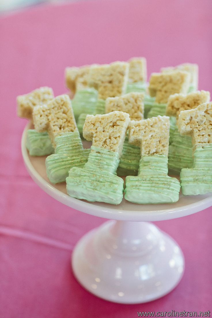 there are many small pieces of food on the cake platter that is ready to be eaten